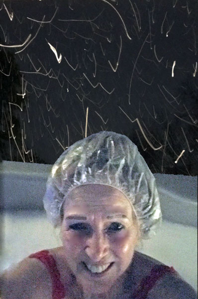 Karen Duquette getting snowed on in the hot tub